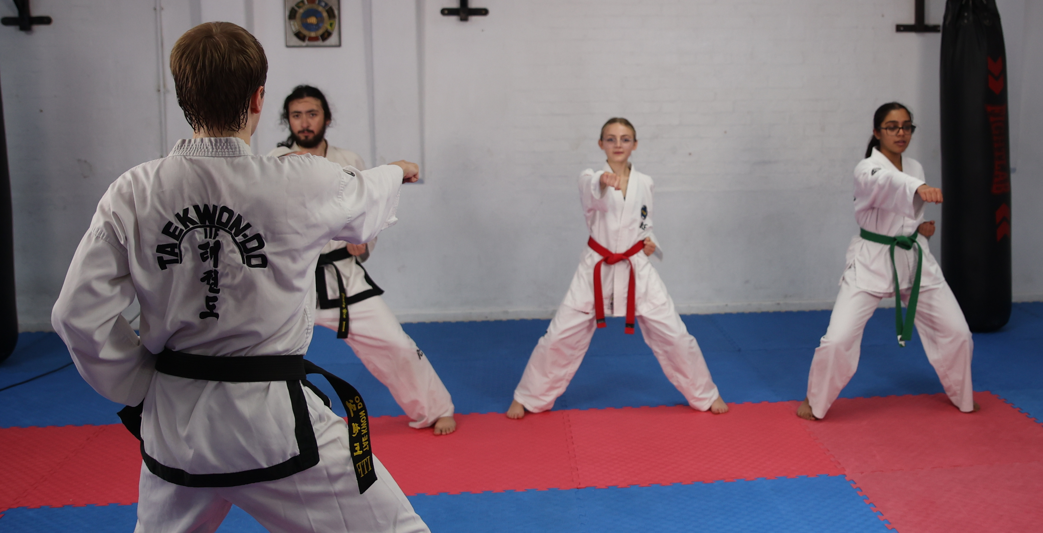 Demonstrating a middle punch in sitting stance.